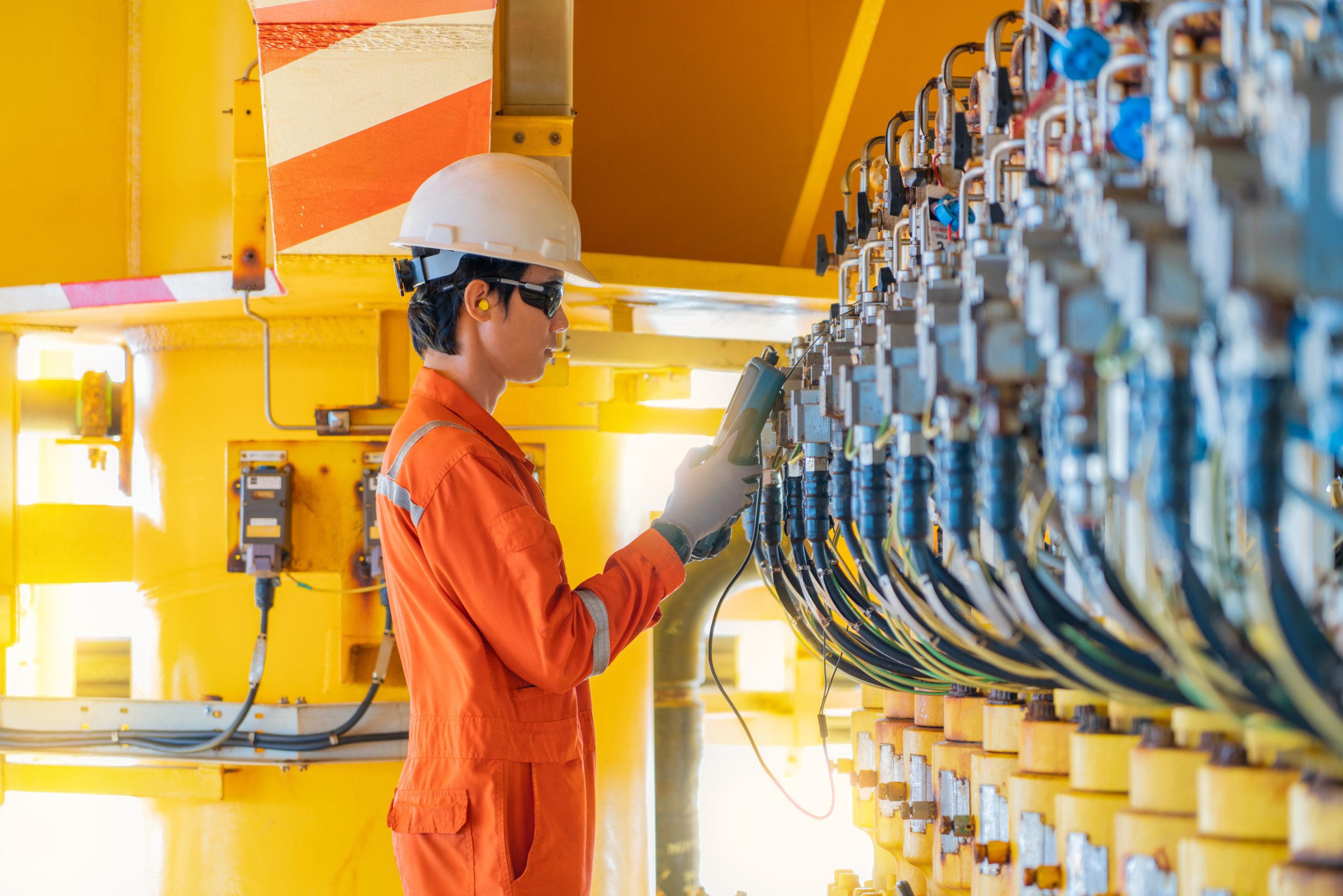 offshore rig worker checking valve positioner dreamstime_l_162901960